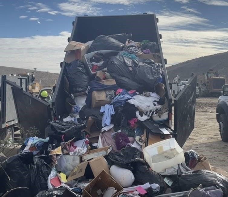 Dumpster trailer dumping junk